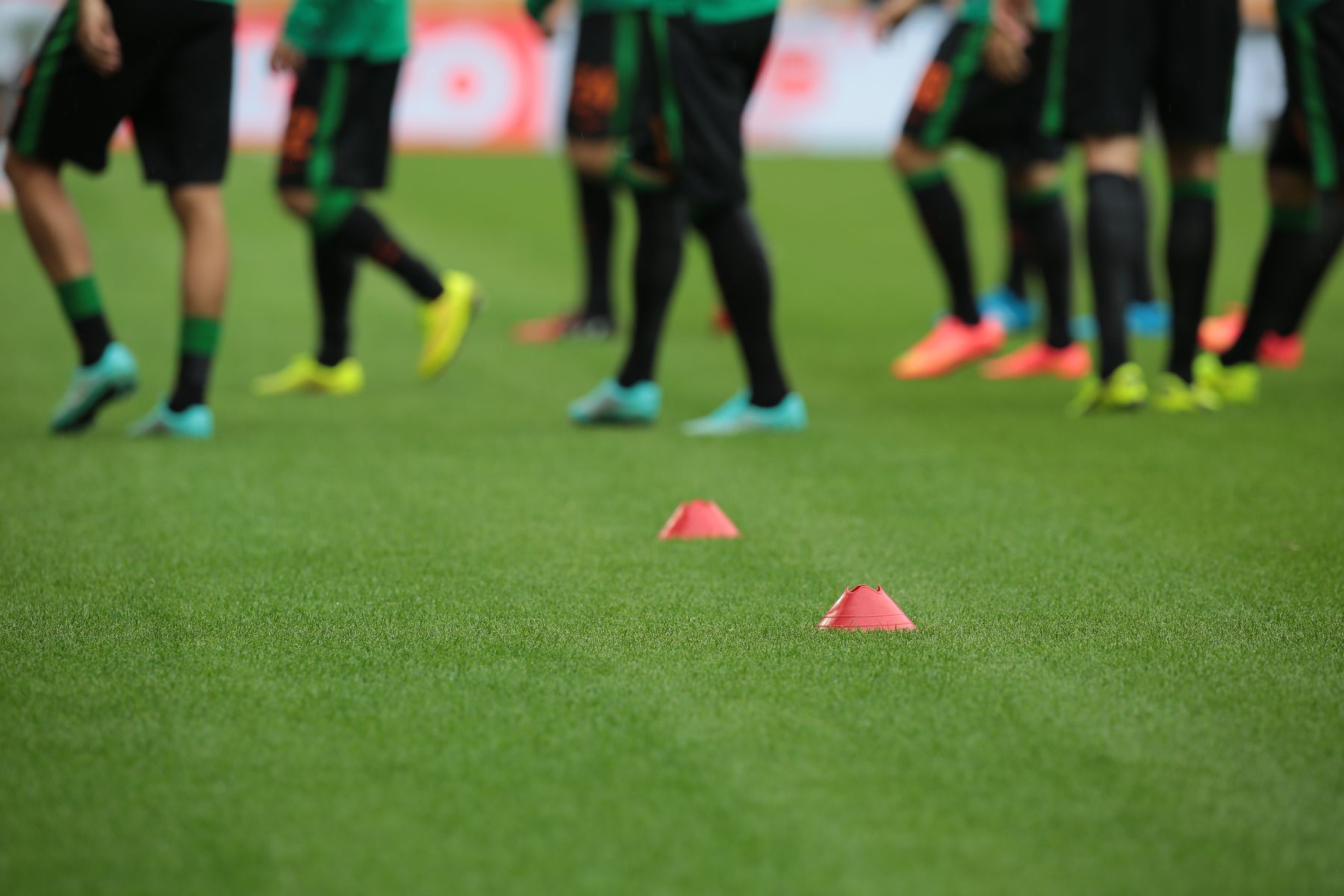 Players warming up behind training cones