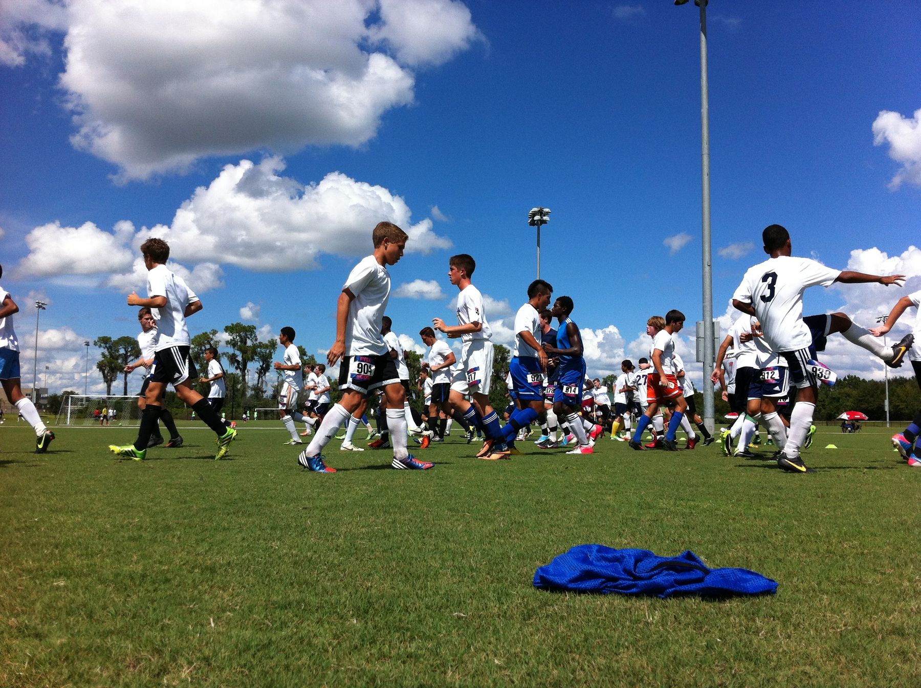 Players warming up together on a sunny club field